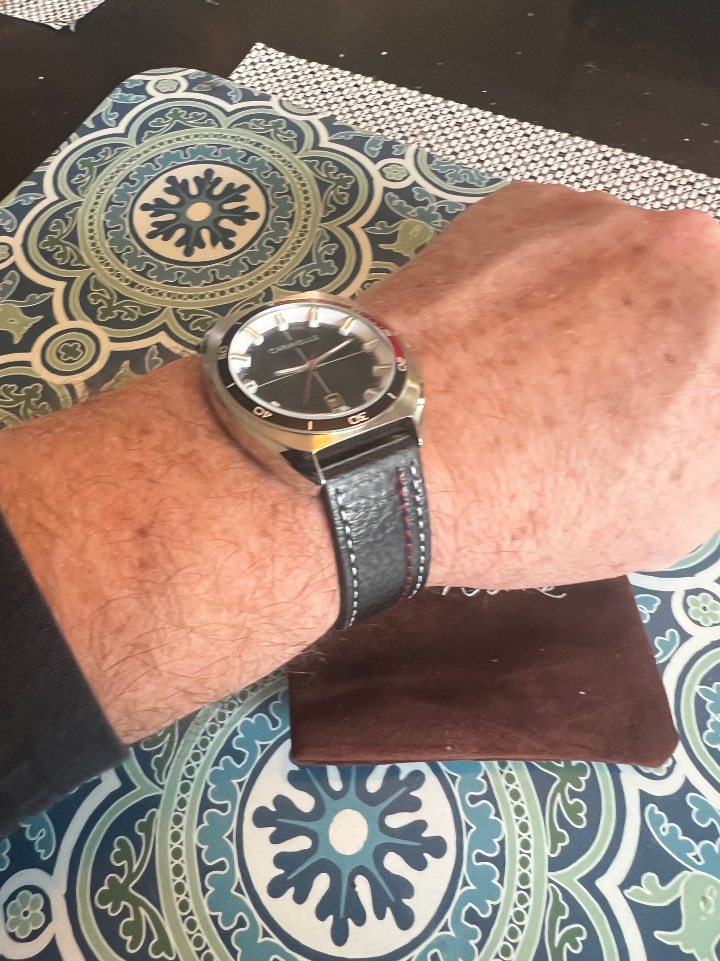 Men’s Caravelle by Bulova black and red bezel