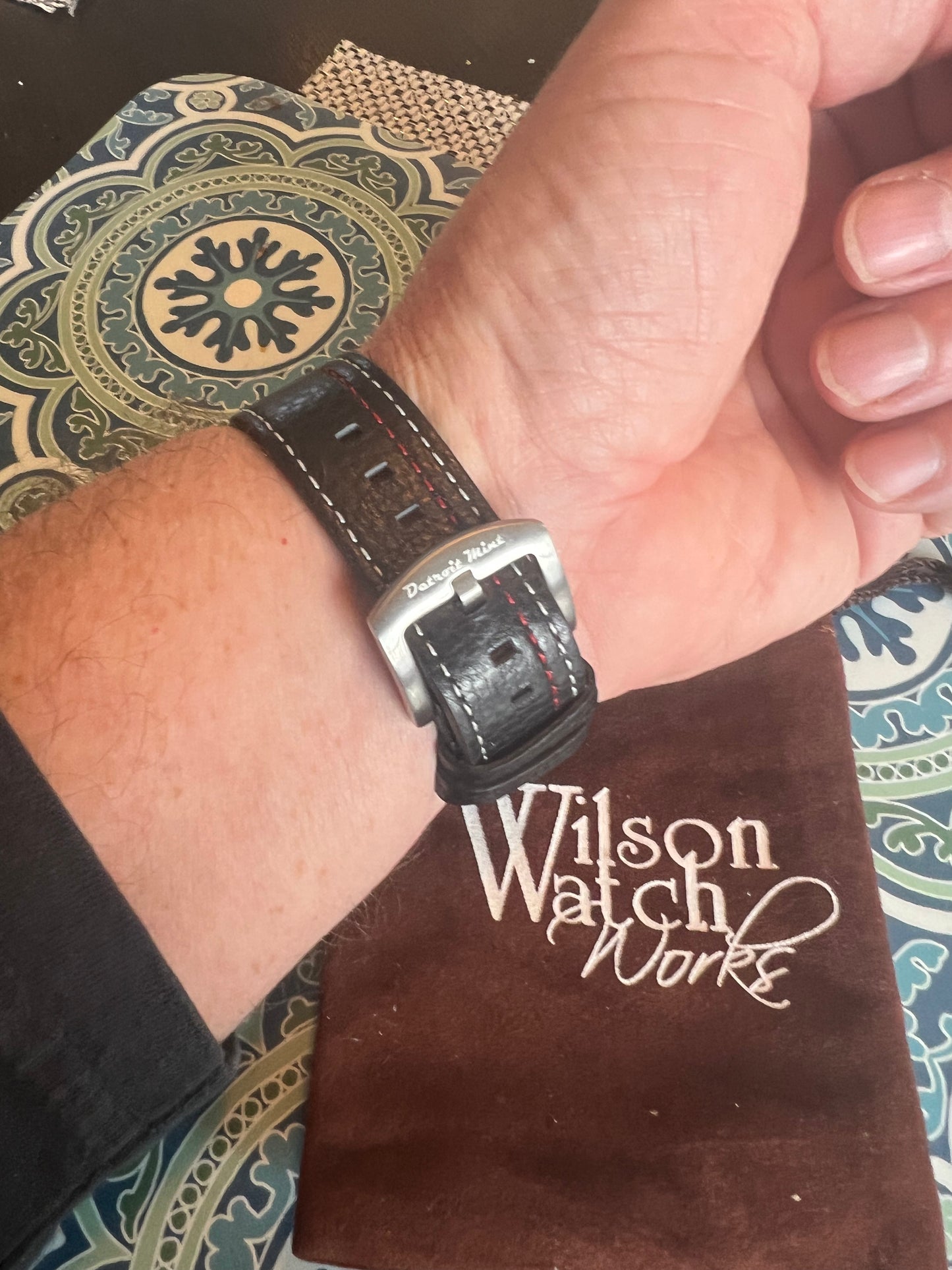 Men’s Caravelle by Bulova black and red bezel