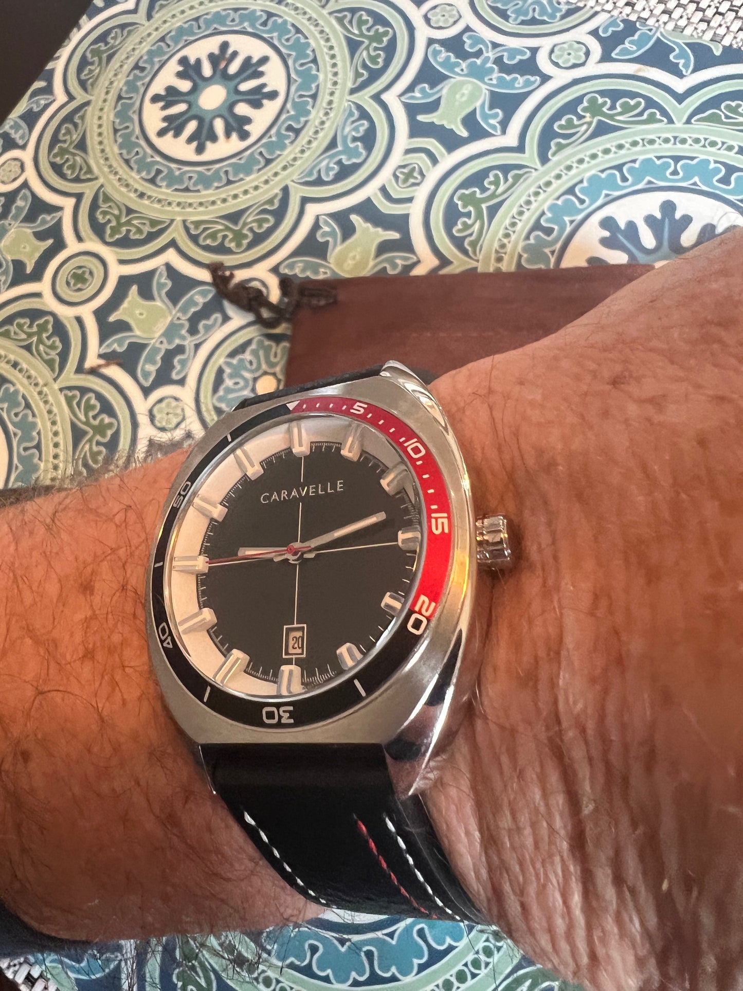 Men’s Caravelle by Bulova black and red bezel