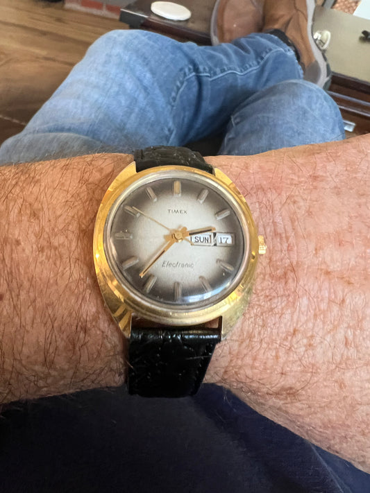 1977 Timex men’s gold tone gradient dial watch.