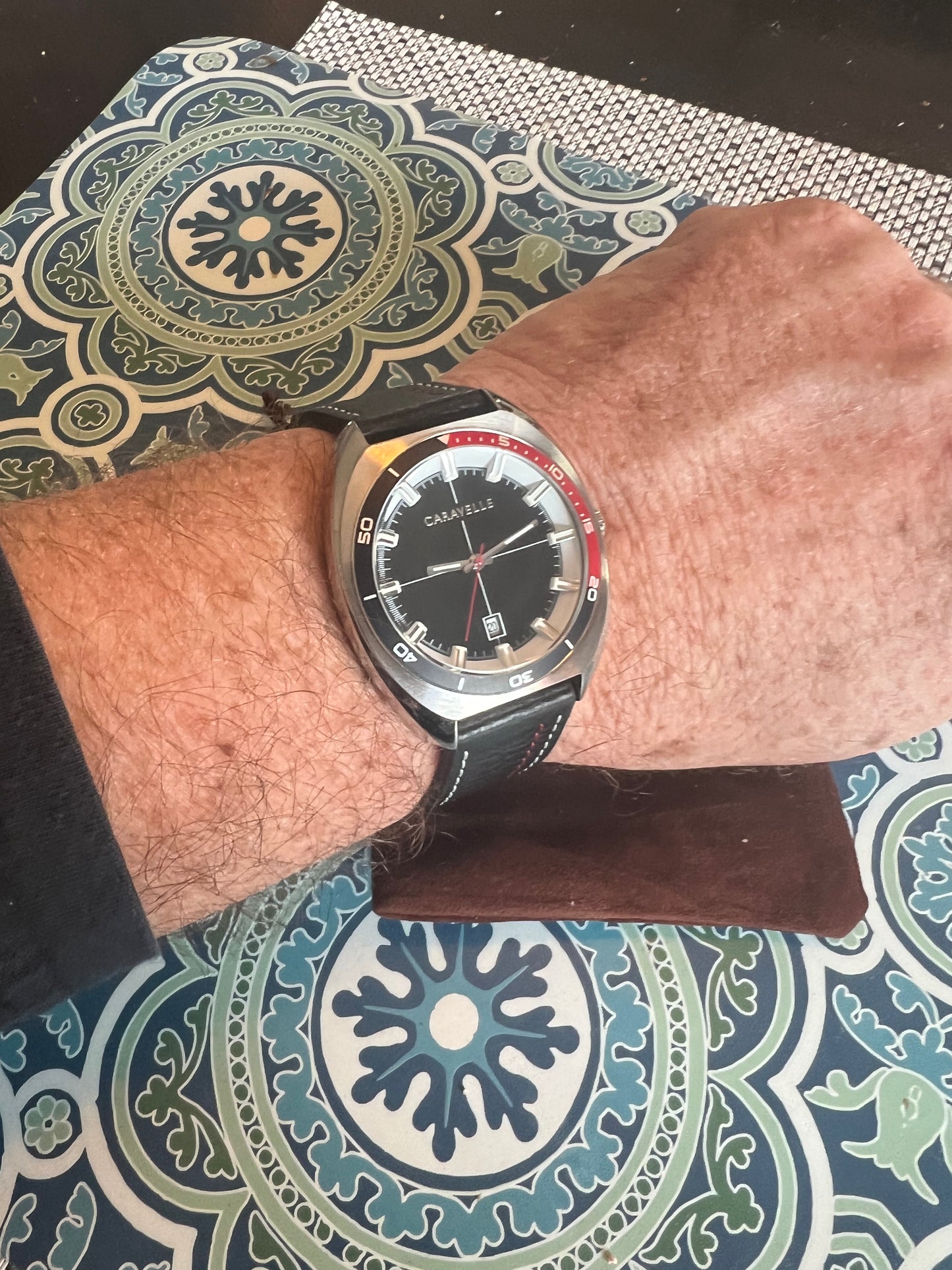Men’s Caravelle by Bulova black and red bezel