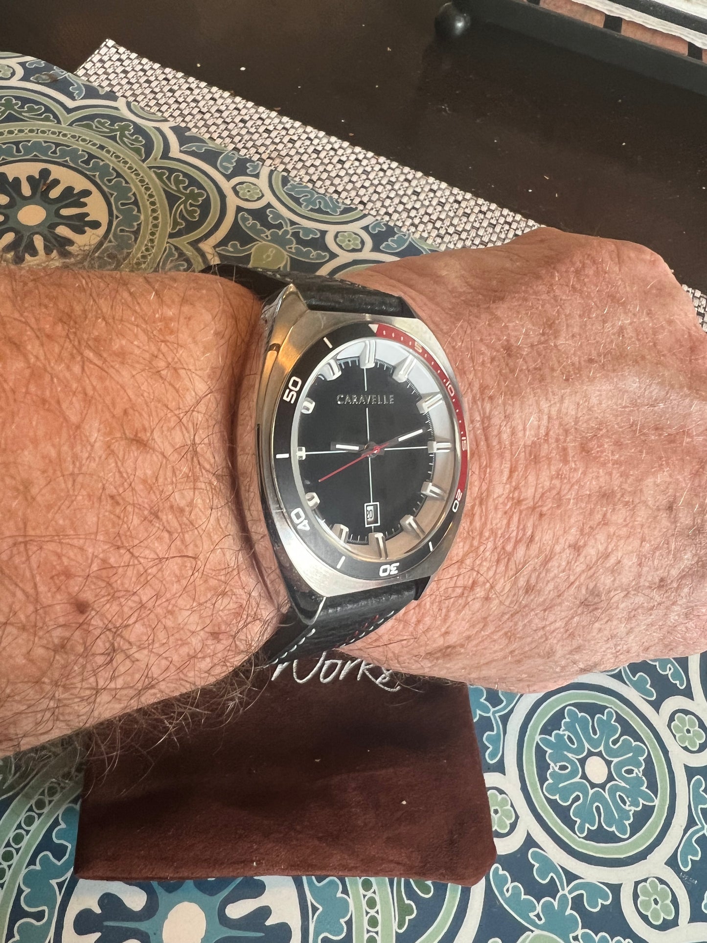 Men’s Caravelle by Bulova black and red bezel