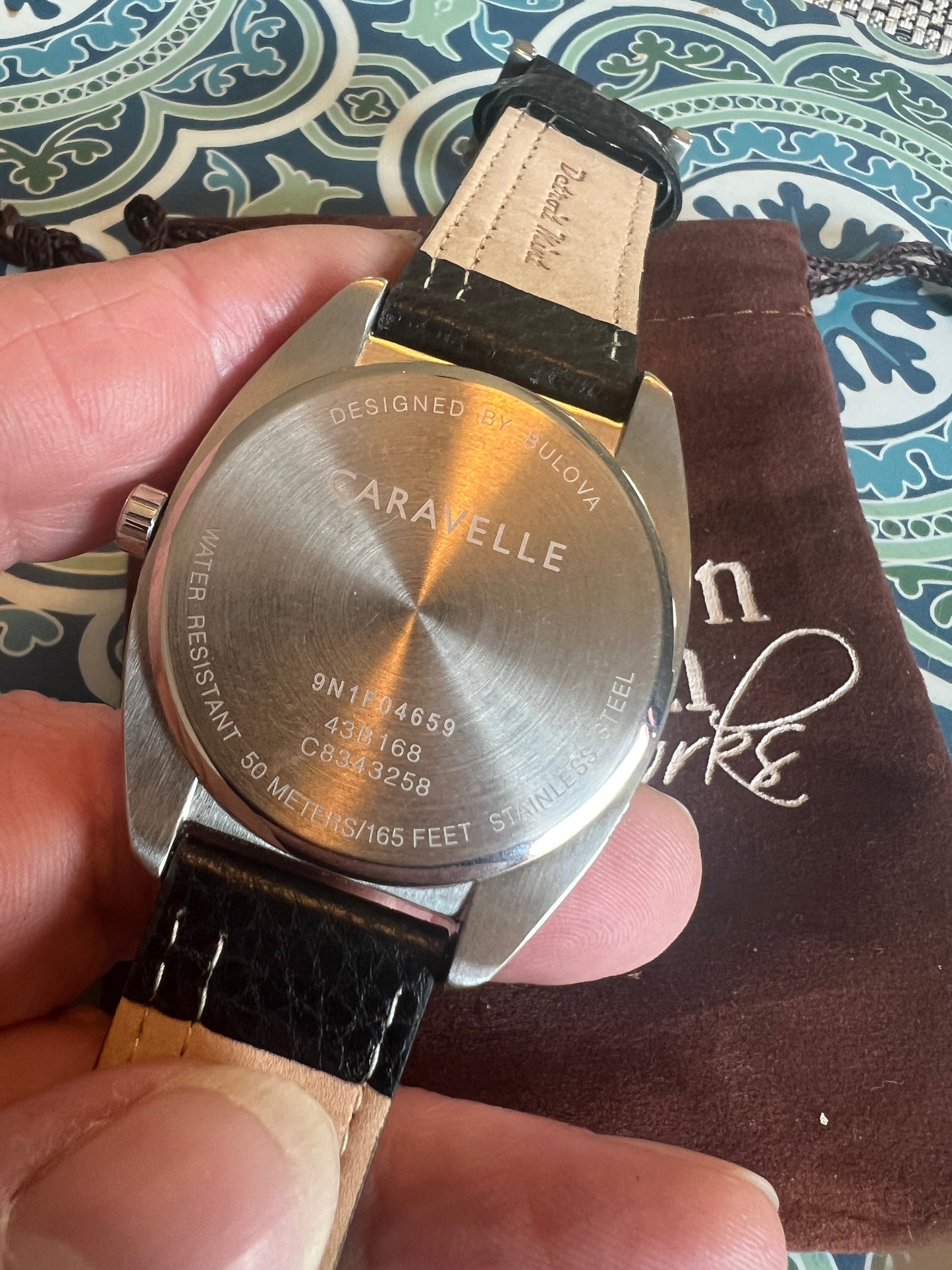 Men’s Caravelle by Bulova black and red bezel